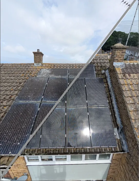 Part-cleaned solar array showing the difference between the washed and unwashed panels