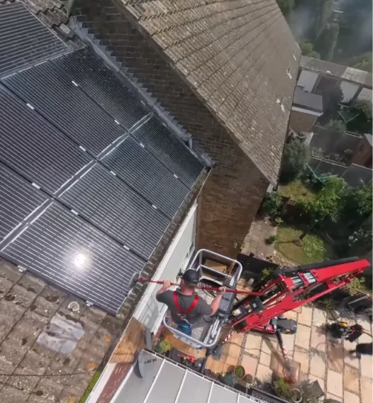 Solar panel cleaning in progress from the platform, looking down onto the array