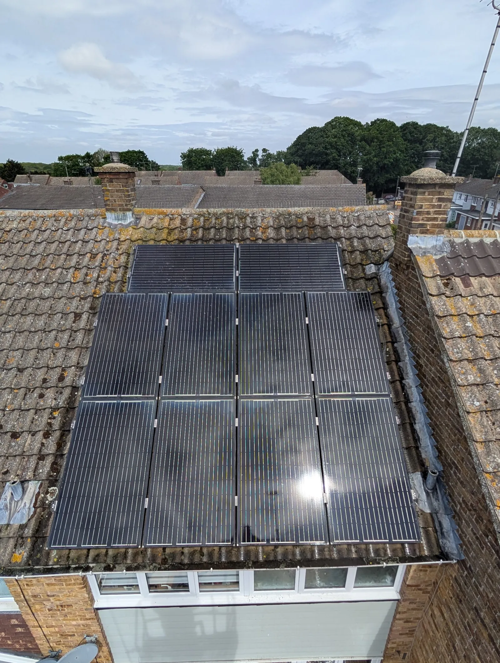 The same rooftop array after cleaning, with the panel glass clear again