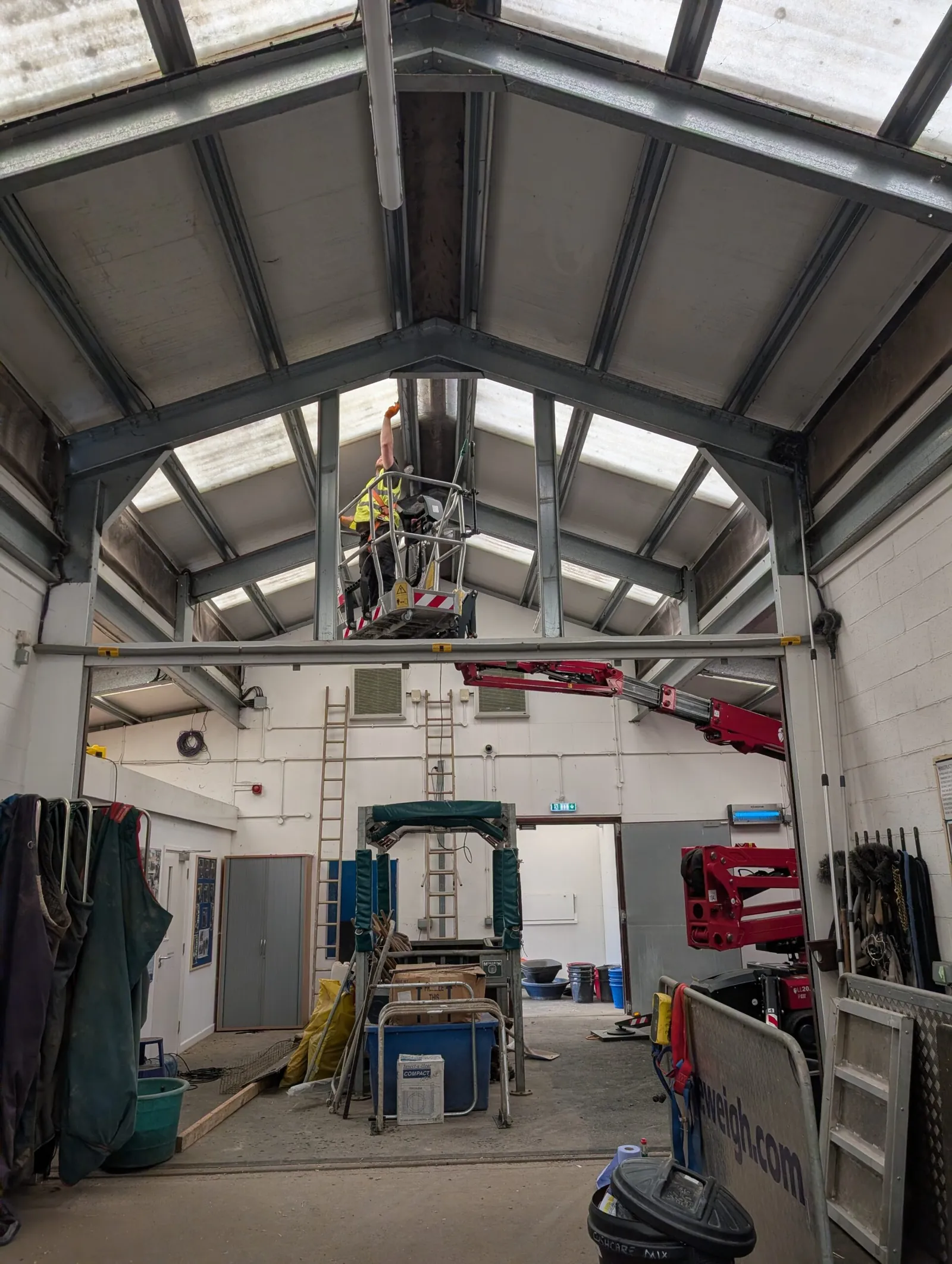 Working platform raised to the apex of a barn roof for internal inspection of trusses and rooflights