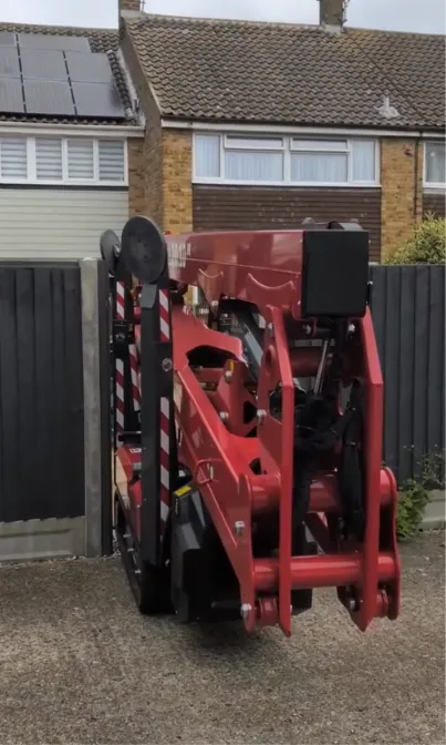 The spider lift tracked down narrow enough to pass through a standard garden gate
