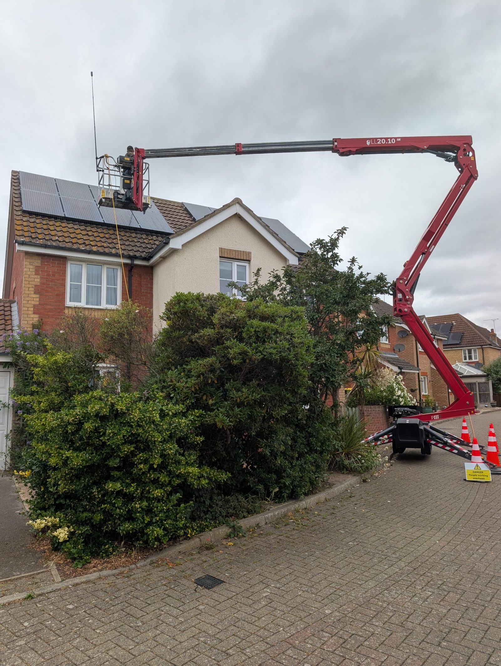 Residential roof and elevation of the kind recorded by drone photogrammetry, shown here with a LADS spider lift working the same roof